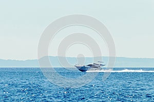 Luxury motor boat cruising in blue sea, Summer vacation