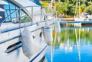 Luxury motor boat yacht anchored at marina, detail view