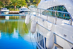 Luxury motor yacht boat anchoring at marina