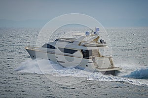Luxury motor yacht cruising the Aegean sea