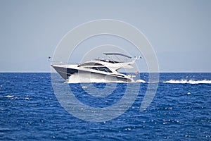 Luxury motor yacht cruising at full speed