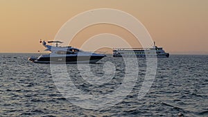 Luxury motor yacht at sunset