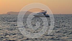 Luxury motor yacht at sunset