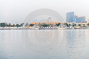 Luxury Motor Yachts Docked along a Major Waterway in Dubai