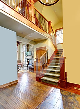 Luxury mountain home hallway with staircase.