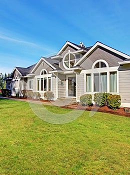 Luxury northwest home with large lawn.