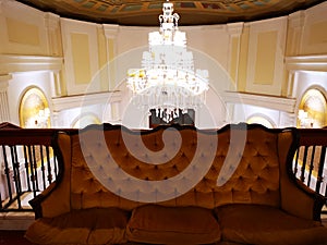 Luxury old chandelier and and leather sofa