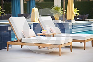 luxury outdoor chaise lounges arranged by the poolside