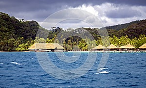 Luxury overwater thatched roof bungalow resort