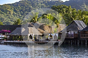 Luxury overwater thatched roof bungalow resort on Bora Bora