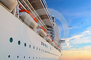 Luxury passenger ship cruise liner at sunrise
