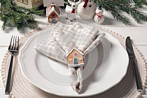 Luxury place setting with beautiful festive decor for Christmas dinner on white table, closeup