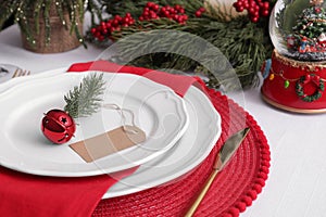 Luxury place setting with beautiful festive decor for Christmas dinner on white table, closeup