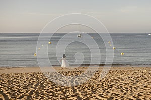 Luxury portrait of woman in white dress at the beach, Algarve, Portugal