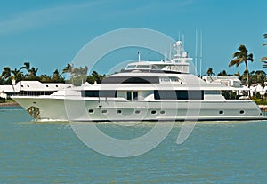 Luxury, power, yacht, cruising the back bay of an island in the tropical, gulf of Mexico