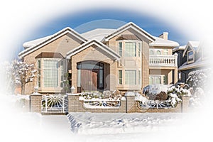 Luxury residential house with front yard in snow on winter sunny day