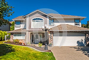 Luxury residential house with grass lawn in front