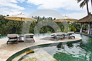 Luxury resort outdoor pool in the jungle of Bali