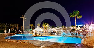 Luxury resort pool in the evening.