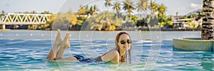 Luxury resort swimming pool. Beautiful woman tourist relaxing in holiday retreat on summer travel vacation. Bikini girl