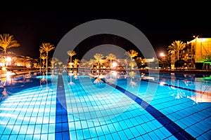 Luxury, resort swimming pool in night