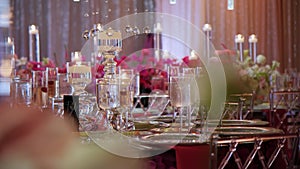 Luxury Restaurant banquet table set up served dinner tableware and silverware. Move camera shot. Close up view