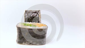 Luxury Restaurant sushi dish Piro maki with fried salmon, onion and fresh cucumber