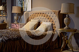 Luxury and rich hotel room. Glamorous, elegant baroque dream bedroom design interior. Brown, beige colour, nobody