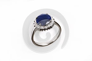 Luxury ring with blue sapphire isolated on white background