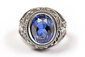 Luxury ring with blue sapphire on white background