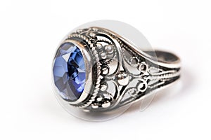 Luxury ring with blue sapphire on white background