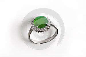 Luxury ring with green gem isolated on white background