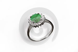 Luxury ring with green gem isolated on white background