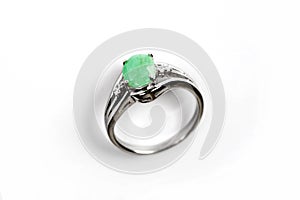 Luxury ring with green gem isolated on white background