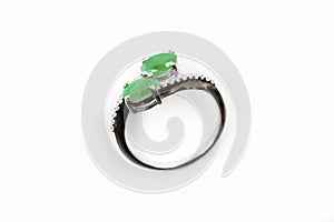 Luxury ring with green gem isolated on white background