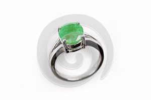 Luxury ring with green gem isolated on white background