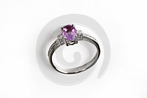 Luxury ring with pink sapphire isolated on white background