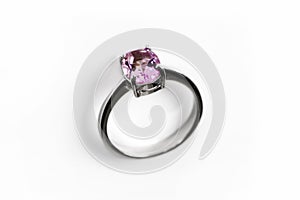 Luxury ring with pink sapphire isolated on white background