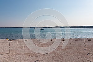 Luxury sailing boats floating in port of coastal town Medulin, Pomer Bay, Kamenjak nature park, Istria peninsula, Croatia