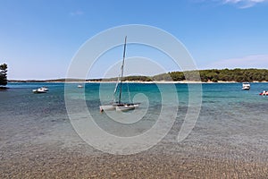 Luxury sailing boats floating in port of coastal town Medulin, Pomer Bay, Kamenjak nature park, Istria peninsula, Croatia
