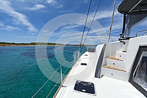 Luxury sailing catamaran moored in a calm bay