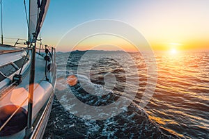 Luxury sailing ship yacht boat in the Aegean Sea during beautiful sunset. Nature.