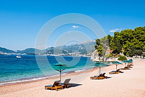 Luxury sand beach near Sveti Stefan historical town, Montenegro. Balkans, Adriatic sea, Europe