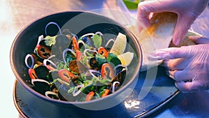 Luxury seafood restaurant delicious dish presentation - fresh mussels served with vegetables and croutons
