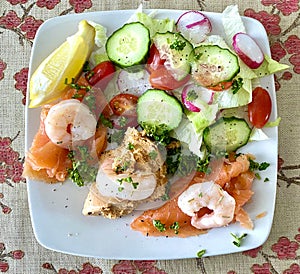 Luxury seafood salad of smoked salmon prawns and crab