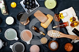 Luxury Set of spa products with accessoires on black background. top view