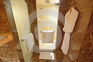 Luxury Shower Room with White Towels and Bath Robes