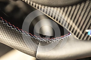 Luxury sport car steering wheel stitching
