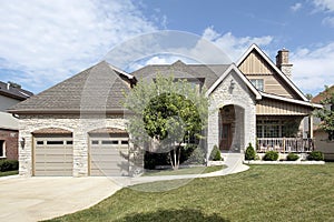 Luxury stone home with front porch