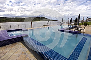 Luxury swimming pool beside lagoon